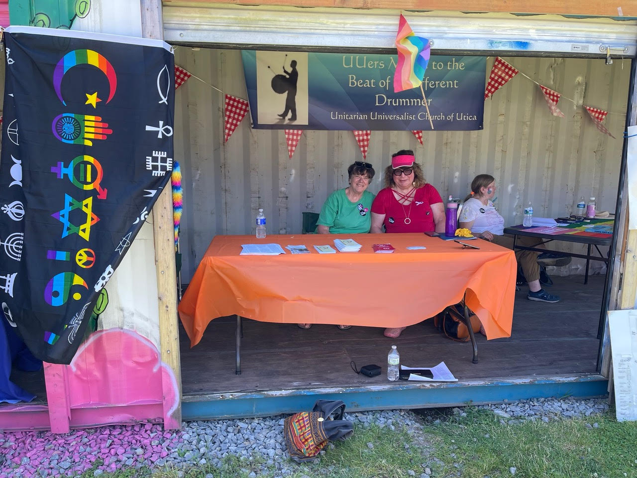 Judy Jerome and Branwen Drew “womaned” the UUUtica booth at the Utica Pride Celebration on Saturday, June 25, 2022.  Sponsored by Indivisible Mohawk Valley and cosponsored by The Compound. Other sponsors include the Interfaith Coalition of Greater Utica, The Oneida County Democratic Party, The Unitarian Universalist Church of Utica, The Q Center at ACR Health, and Utica Coffee Roasting Company.